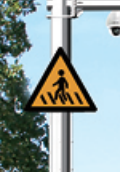 Pedestrian warning sign integrated into urban road guidance pole Pedestrian warning sign integrated into urban road guidance pole