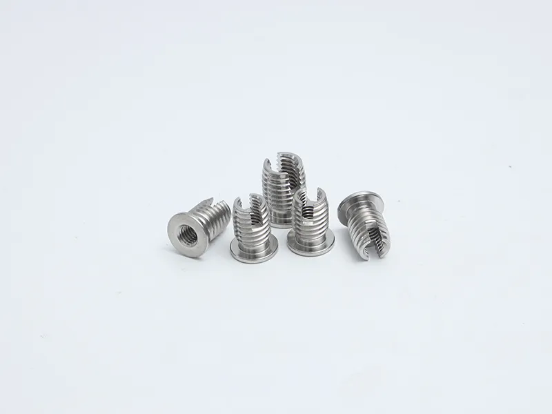 Flanged self-tapping screw insert