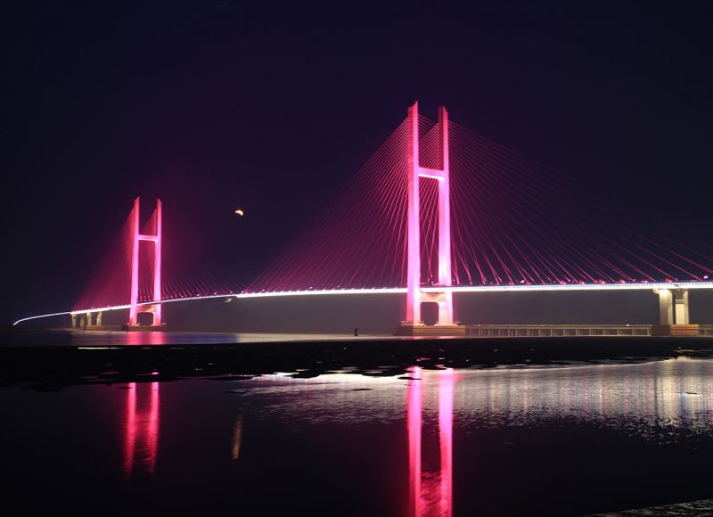 Architectural bridge lighting highlighting bridge structure and cable system