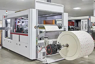 Paper bag production equipment with a roll of printed paper