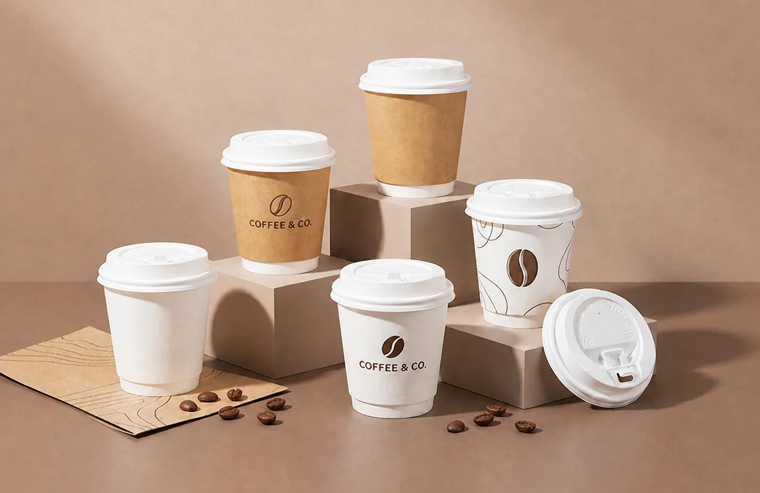 Printed kraft and white paper coffee cups with lids in assorted sizes
