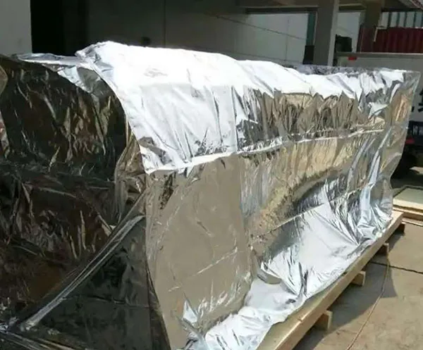 Equipment shipped in wooden crates with aluminum-coated woven vacuum packaging