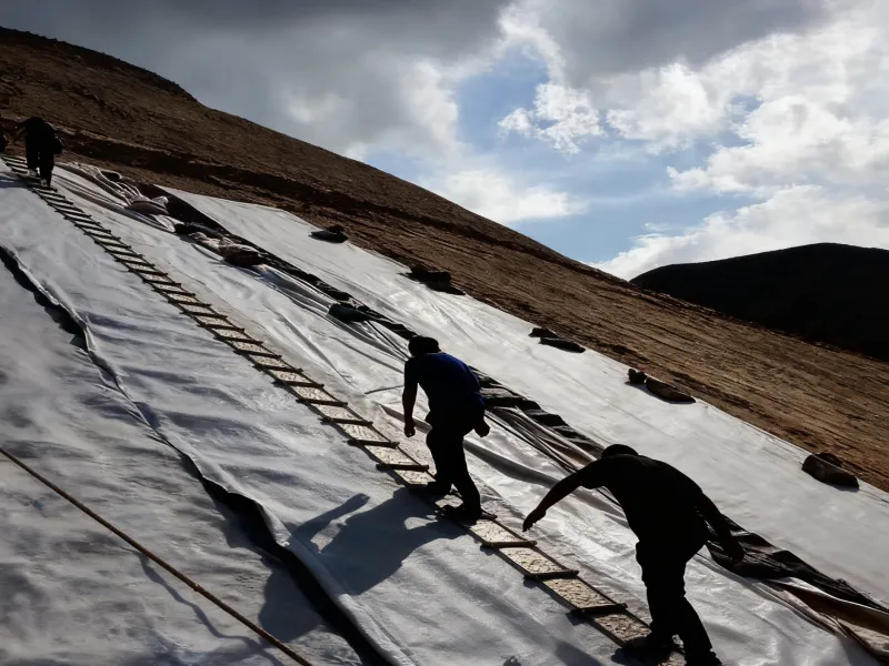 Weather-proof, impact-resistant, reinforced, long-life mining composite geomembrane