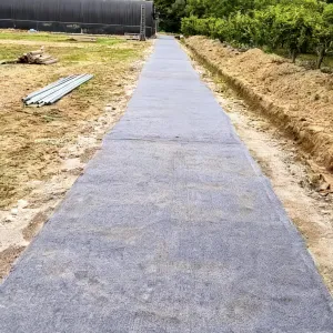 Rapid-hardening, cost-effective, tough, traffic-resistant road construction concrete canvas