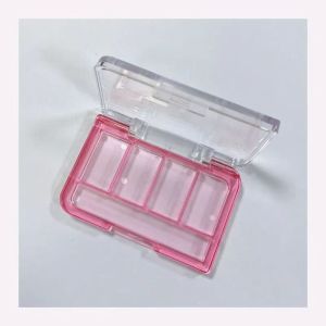 Four-color eyeshadow palette with brush holder.
